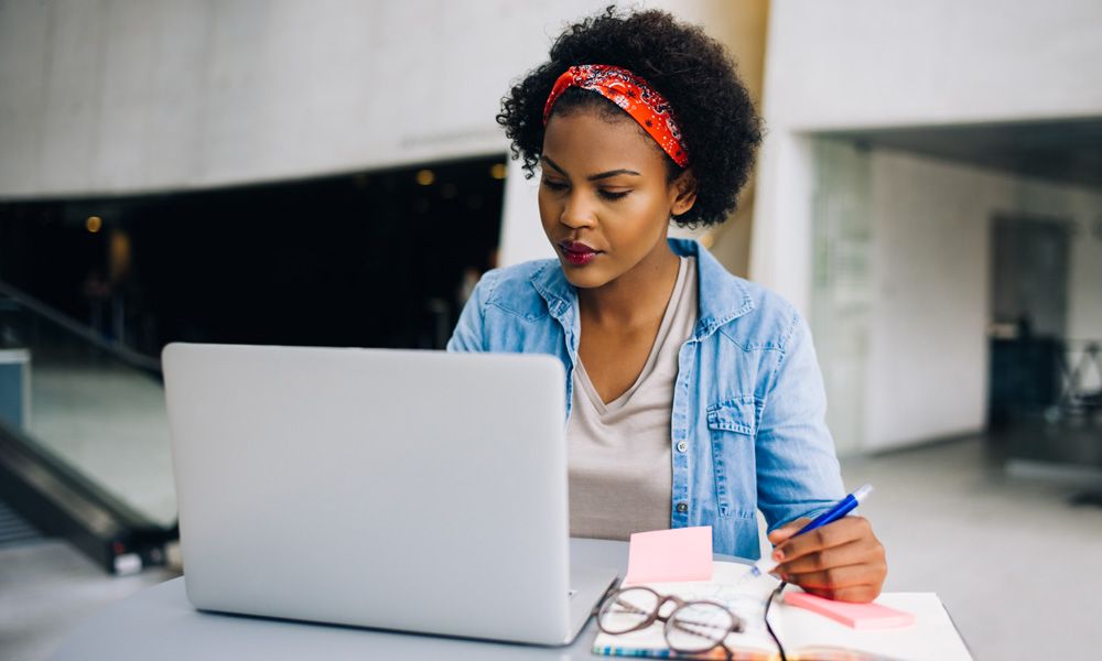 woman looking at laptop